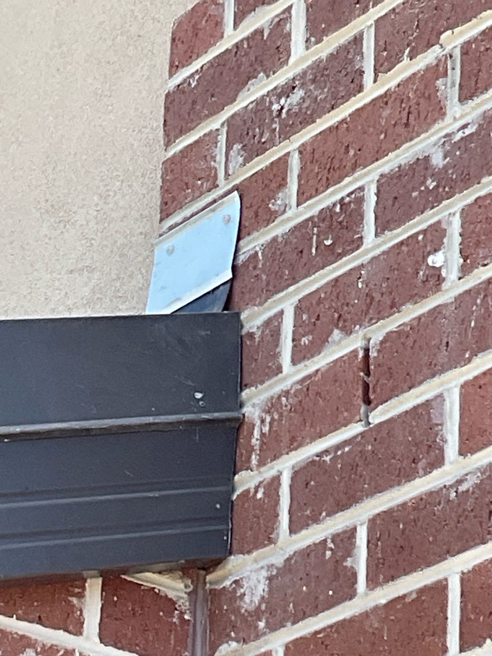 Flashing against the wall cladding left unsealed, an easy path for water, found during a fixing inspection in Kalkallo
