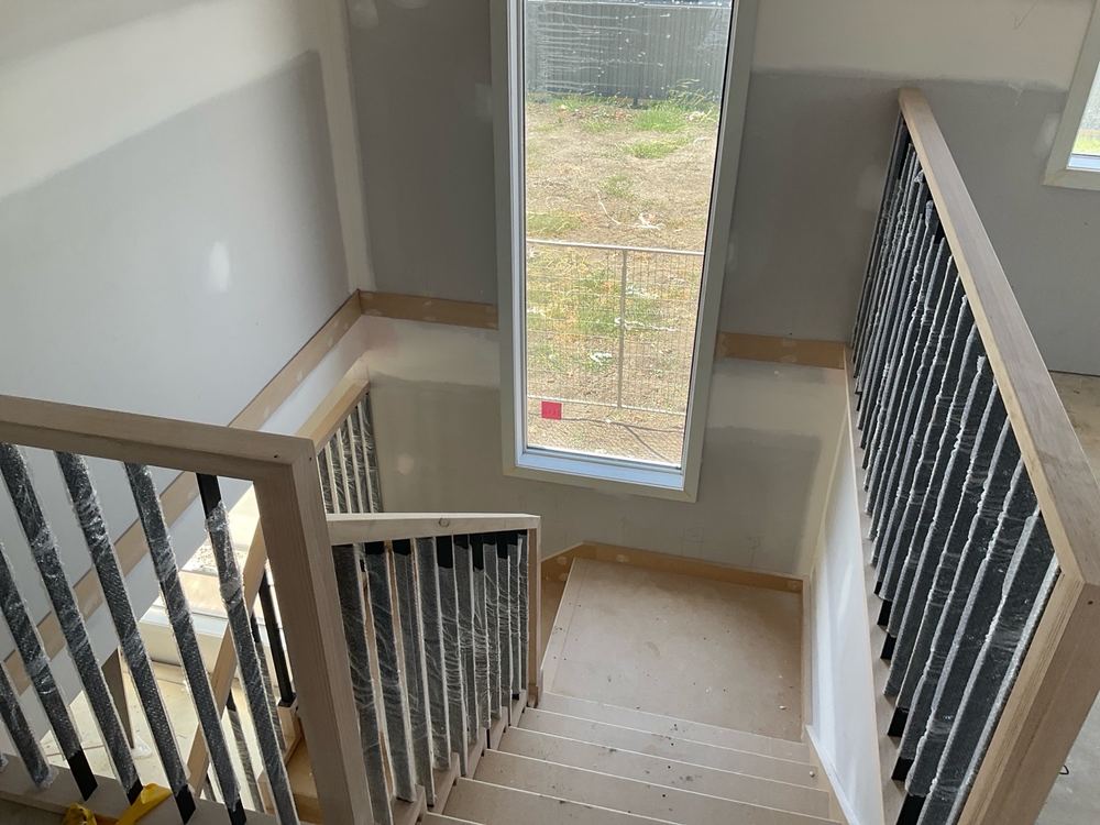 Stair handrail left rough, needing a proper sand before paint goes on, Kalkallo