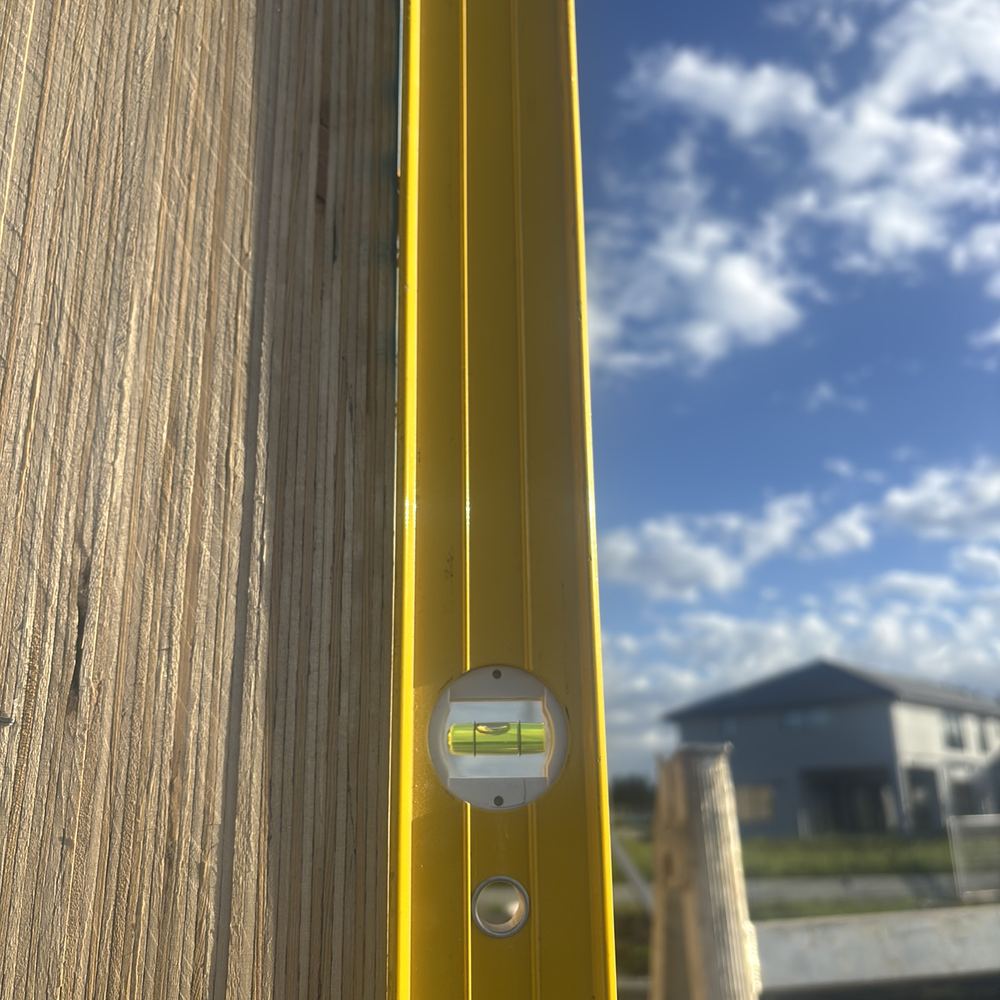 Frame wall leaning out of vertical beyond the tolerance limit, checked with a level, found during a frame inspection in Kalkallo