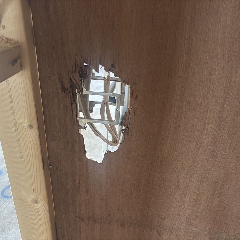 Structural bracing cut through beside the pantry, weakening resistance to wind load, found during a lock-up inspection in Kalkallo