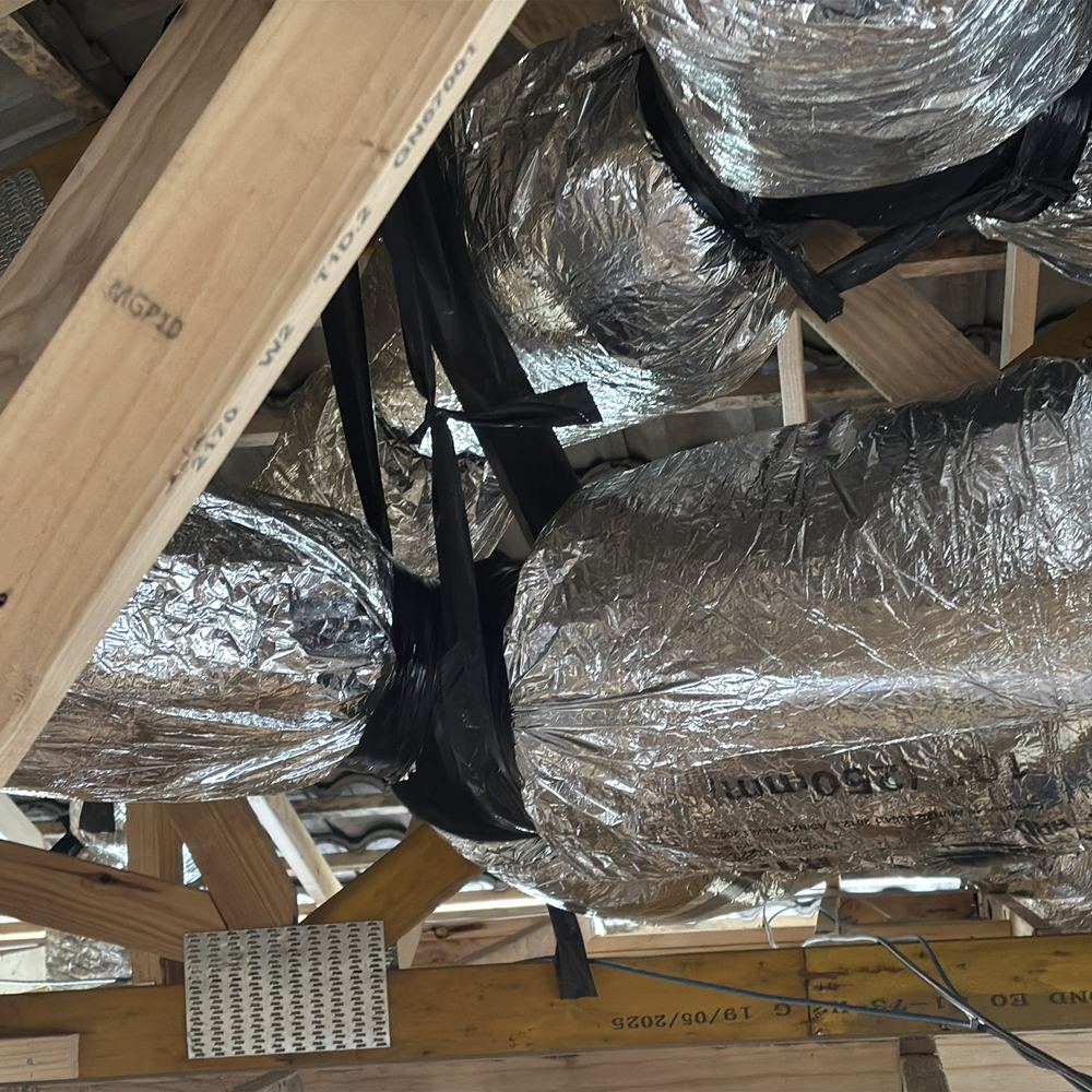 Heating and cooling ducts crimped by tight bends and poor support in the roof, found during a lock-up inspection in Kalkallo
