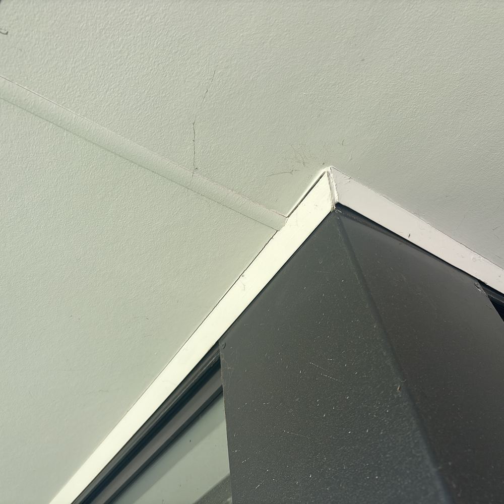 Minor plaster cracking recorded where an internal wall meets the ceiling, found during a pre-purchase inspection in Kalkallo