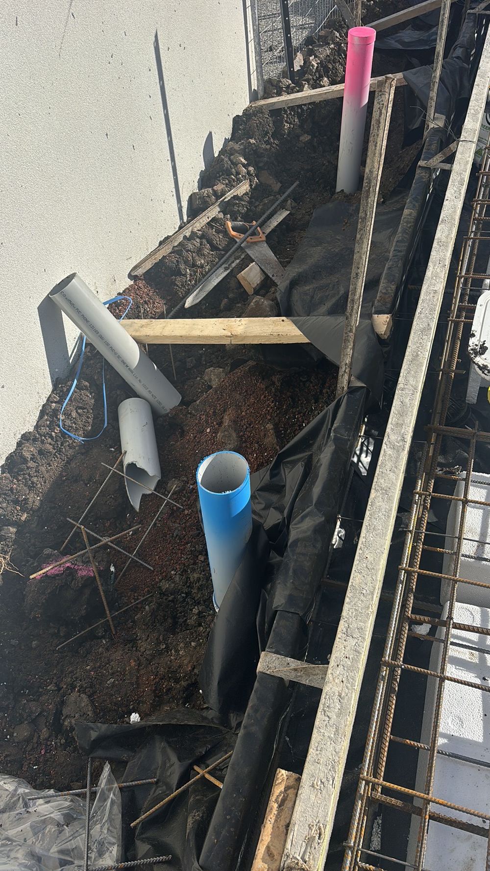 Sewer and stormwater pipe ends left open, inviting debris and later blockages, Kalkallo